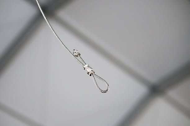 Cables and hook hanging from the Ceiling at the Construction site